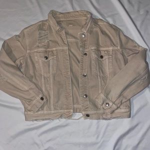 distressed and ripped cropped pinky beige denim jacket